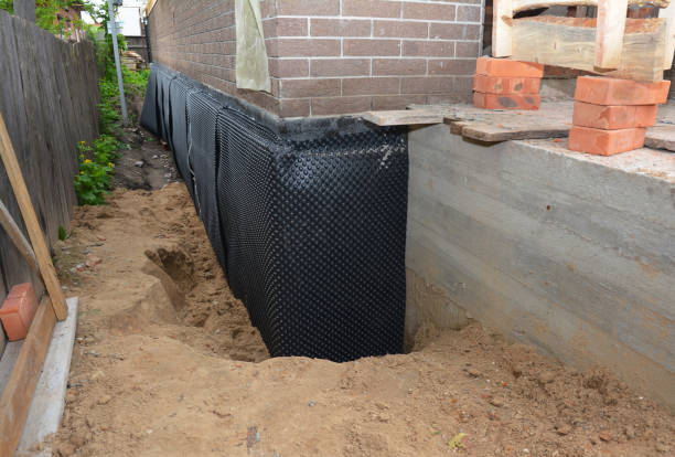 SJ Waterproofing Pros technician performing targeted Interior Drainage System assessment in Irvington, NY